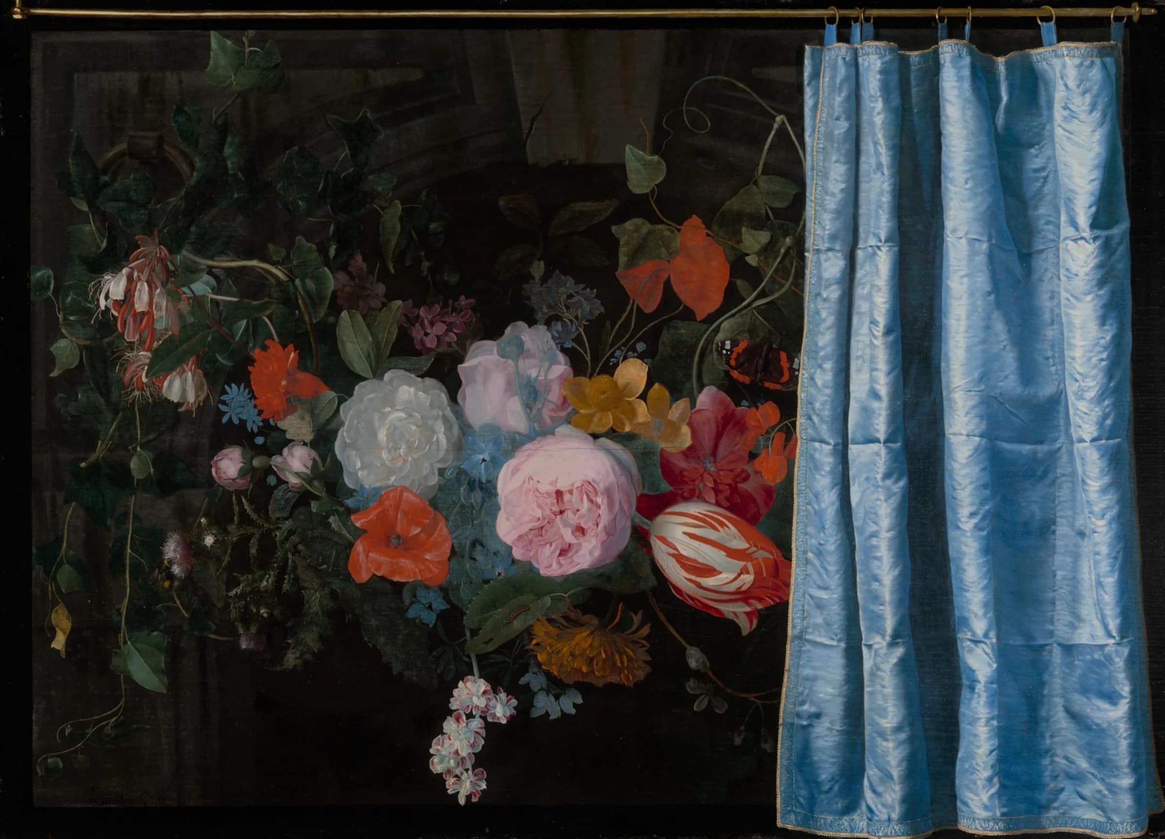 A painted flower garland behind a blue silk curtain drawn half across it